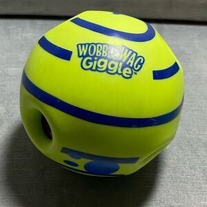 Wobble wag, giggle ball, interactive, toy designed for dogs. “Giggling” sound.